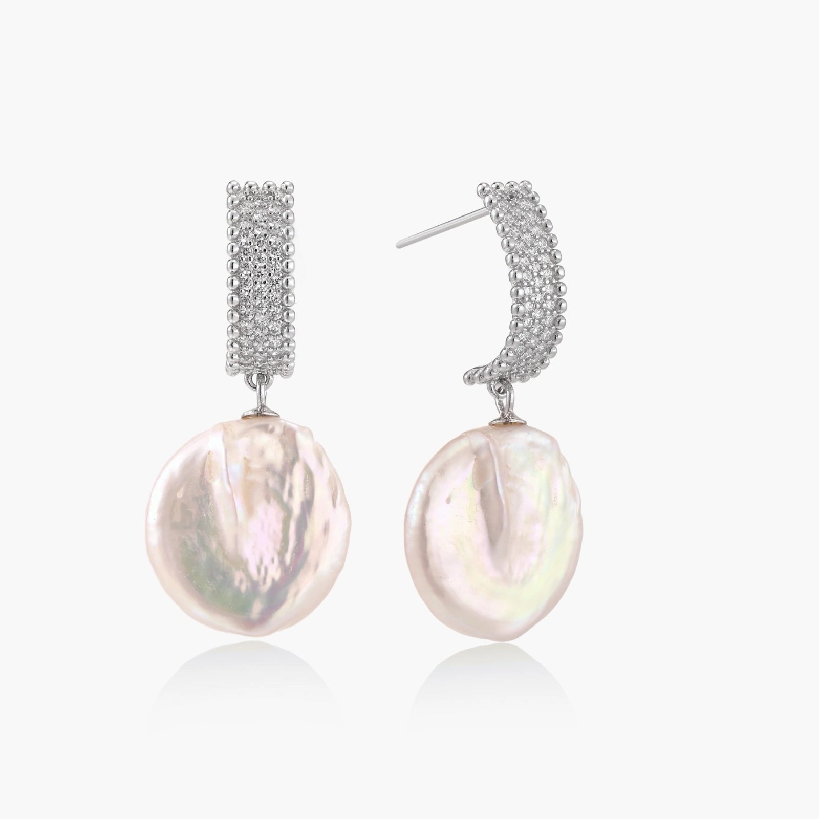 Rhodium-plated silver curved stud with pave stones and baroque pearl drop on white background