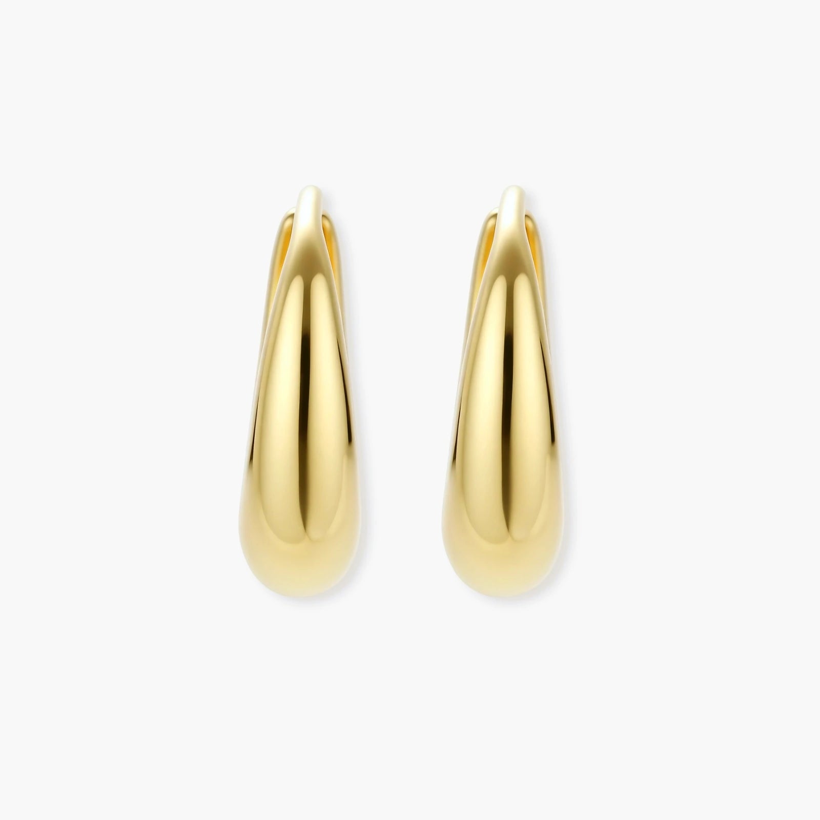 Chunky gold-plated sterling silver huggie hoop earrings with hinged closure mechanism on cream background.