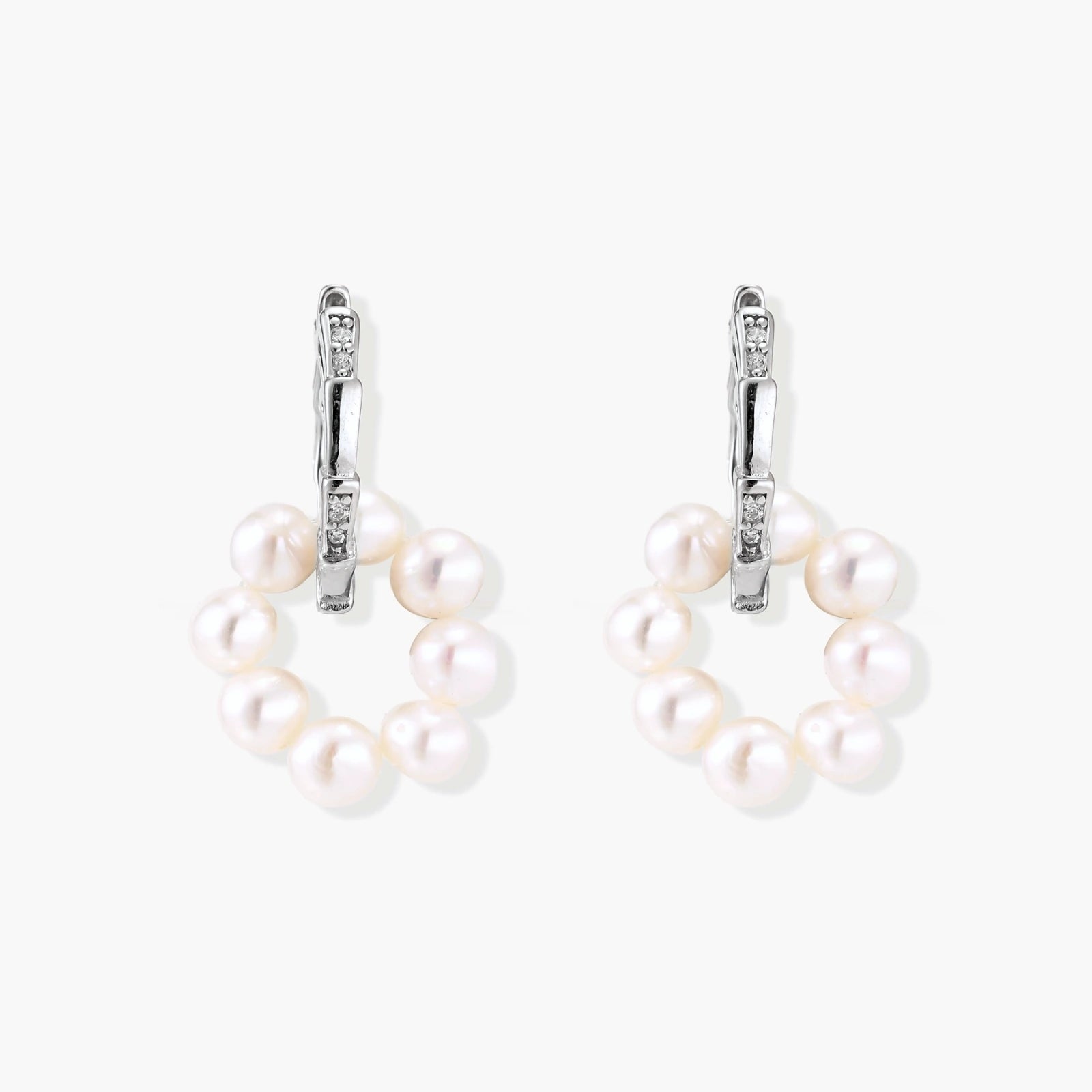 Rhodium-plated silver hoop earrings with freshwater pearls arranged in crescent formation and diamond accents