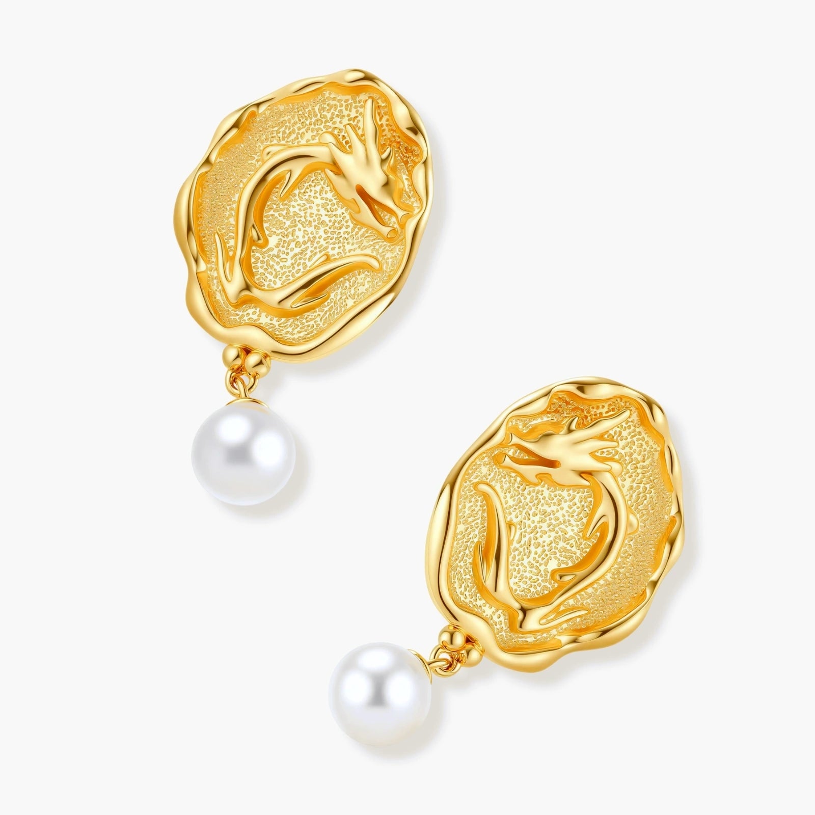 Ornate gold-plated dragon medallion earrings with white shell pearl drops on beige background, featuring detailed Chinese motifs.