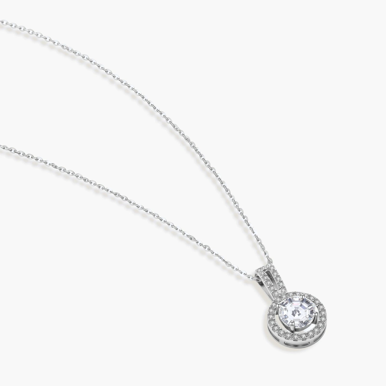 Platinum-plated sterling silver necklace with round halo pendant featuring central crystal surrounded by smaller stones