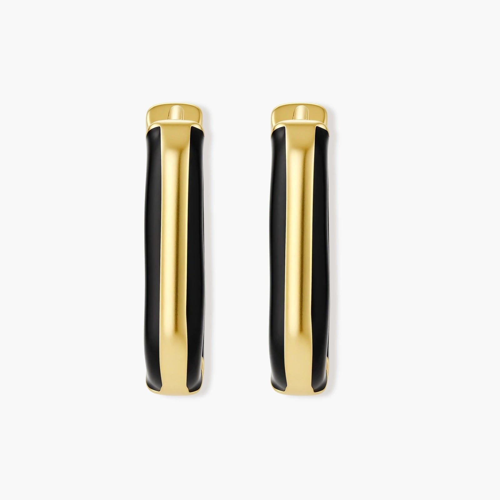 Modern hoop earrings with gold-plated and black sections, featuring hinged closure on white background.
