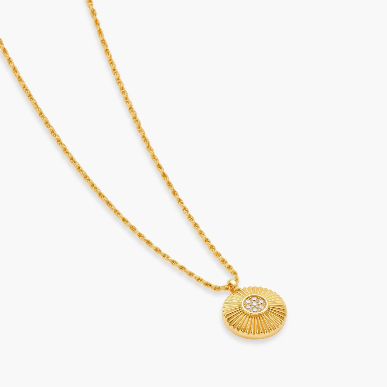Gold-plated sterling silver necklace with sunburst pendant featuring radiating lines and cubic zirconia center stones