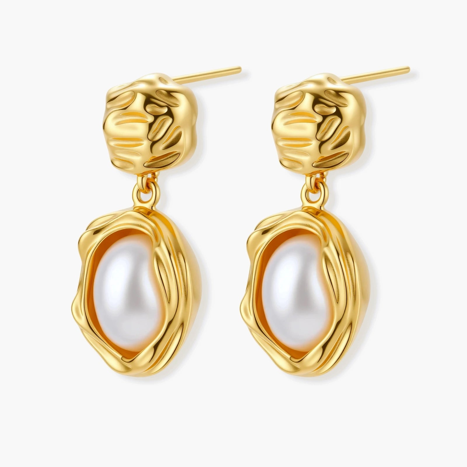 Gold-plated textured stud earrings with white freshwater pearl drops against cream background, showing organic rippled design